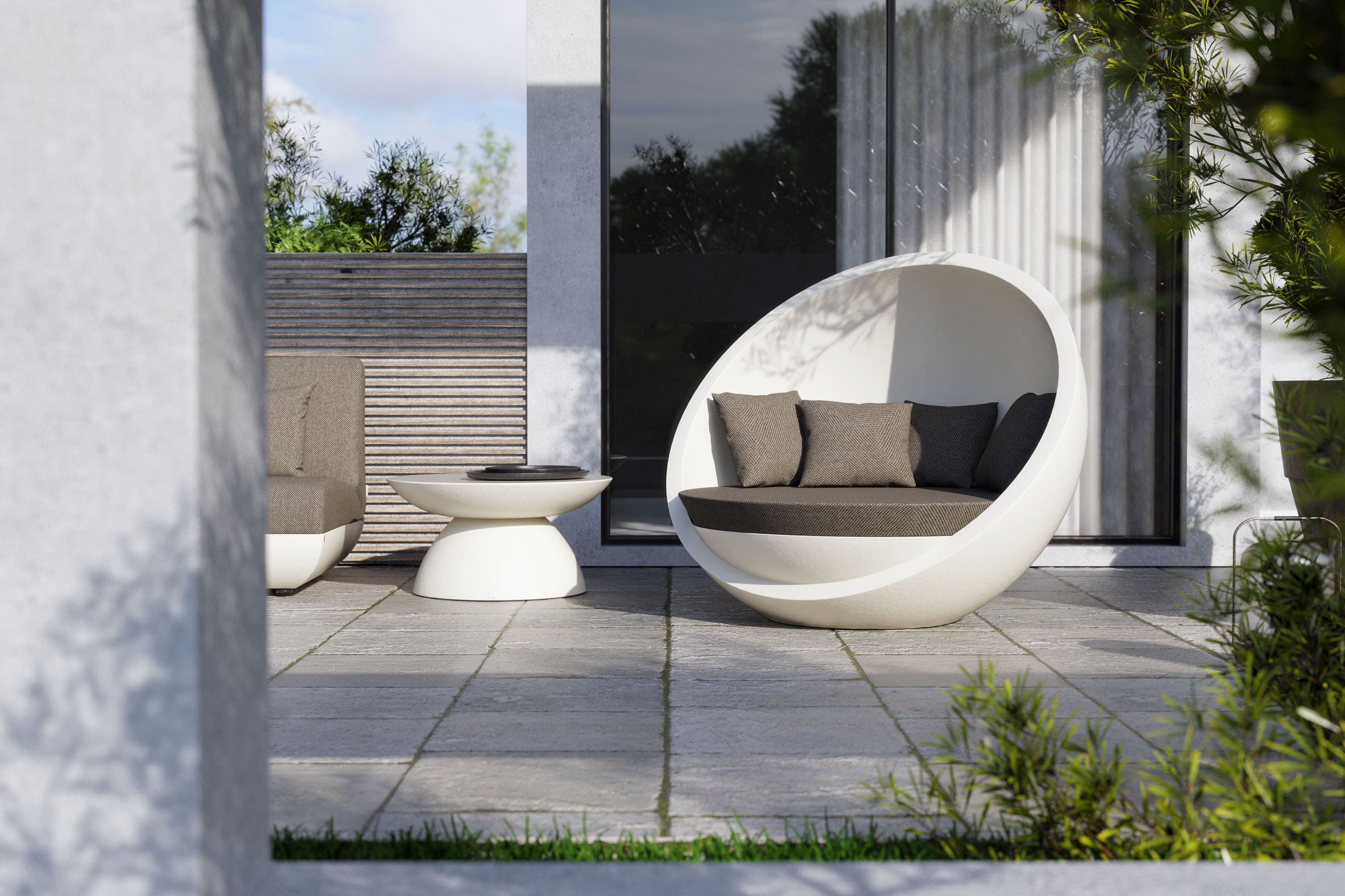 Relaxing ambience on terrace with Bola sofa and Oceano table